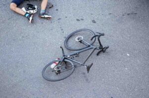 Mesa bicycle accident scene showing damaged bike and car 